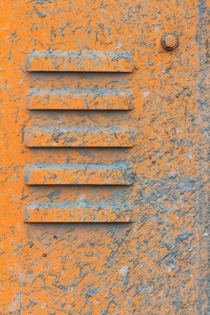 Vents on the yellow metal plate with splashes of cementの写真素材