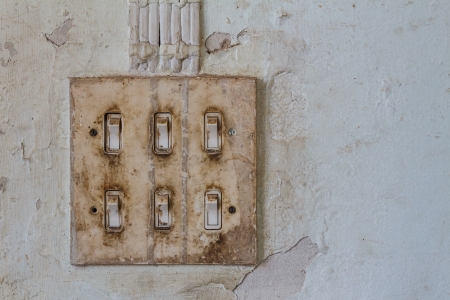 Old light switch on old wallの写真素材