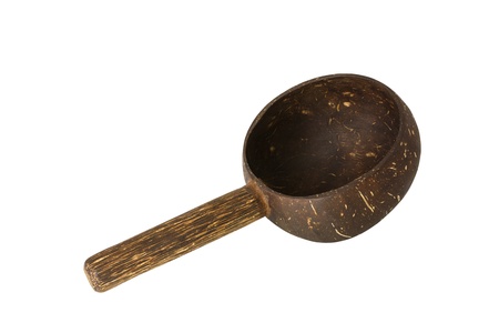 Dipper made from coconut shell, traditional container for drinking water of Thai people, isolated on white backgroundの写真素材