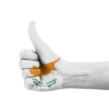 Hand with thumb up, Cyprus flag painted as symbol of excellence, achievement, good - isolated on white backgroundの写真素材