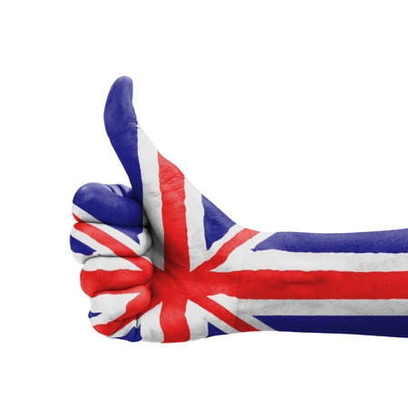 Hand with thumb up, UK (United Kingdom) flag painted as symbol of excellence, achievement, good - isolated on white backgroundの写真素材