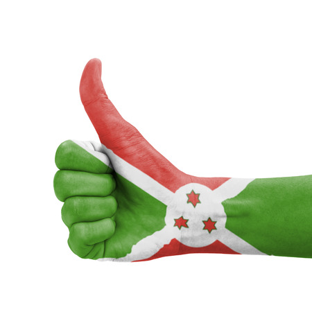 Hand with thumb up, Burundi flag painted as symbol of excellence, achievement, good - isolated on white backgroundの写真素材