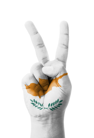 Hand making the V sign, Cyprus flag painted as symbol of victory, win, success - isolated on white backgroundの写真素材