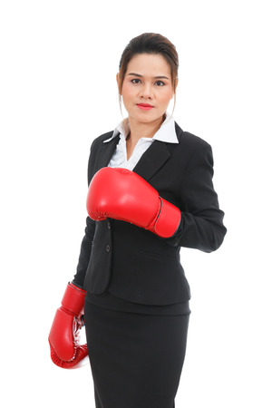Asian business woman with boxing gloves isolated on white backgroundの写真素材