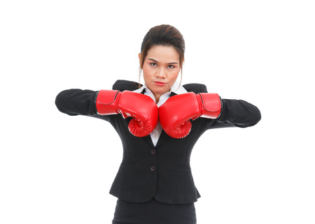 Asian business woman with boxing gloves isolated on white backgroundの写真素材