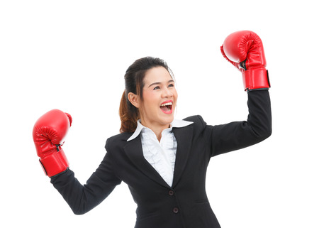Asian business woman with boxing gloves isolated on white backgroundの写真素材