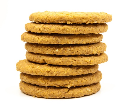stacked wholemeal cookies on a white background の写真素材