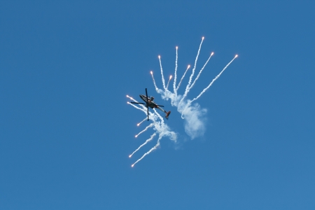 LEEUWARDEN,FRIESLAND,HOLLAND-SEPTEMBER 17:: Apache AH-64D Solo Display Team is flying an Airshow on September 17, 2011 at Leeuwarden Airfield, Friesland, Holland. のeditorial素材