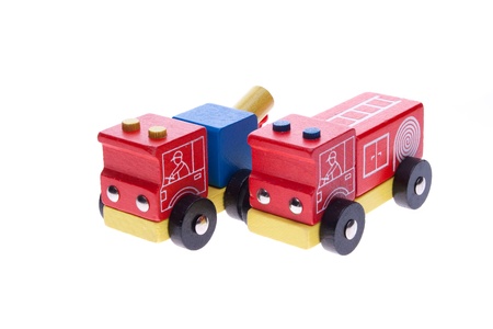 Wooden toy tow truck and fire truck on a white background