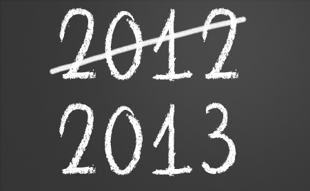 2012 crossed and new year 2013 written on chalkboardの写真素材