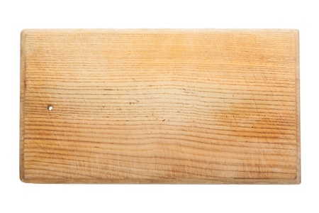 Old worn and scratched wooden cutting board isolated on white
