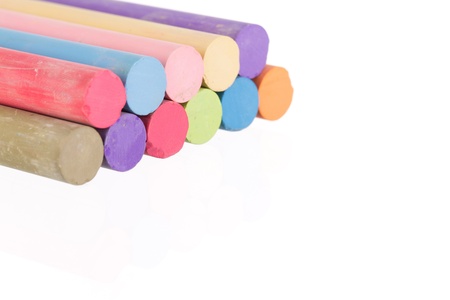 Stacked colorful chalk sticks  with copy space and on a white backgroundの写真素材