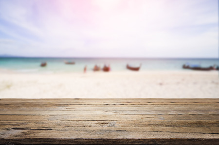 wooden desk on beach side. rusty pink background colorの写真素材