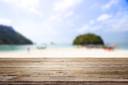 wooden desk on beach side. rusty pink background colorの写真素材