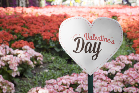 Happy Valentines Day banner in the flower graden.の写真素材