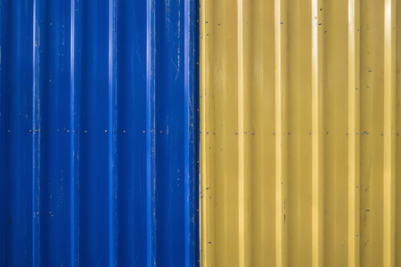 Blue and Yellow Corrugated Iron Fenceの写真素材