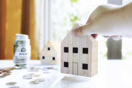 Mortgage concept by money house from the coinsの写真素材