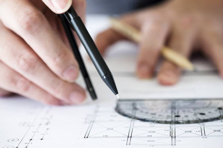 Architect or engineer working on blueprint, Construction concept. Engineering tools.