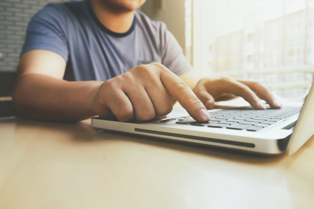 Man hands typing on a PC or laptop keyboard.の写真素材