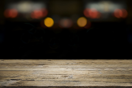 Empty wooden table platform and bokeh at nigh for present product