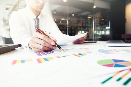 Startup businessman working with business documents on office table with graph financial diagram. Business idea concept.の写真素材