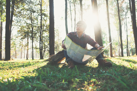 Relax adventure and lifestyle hiking travel idea concept. Young Man Traveler with backpack relaxing...