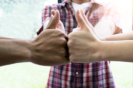 Business startup teamwork success. Thumbs Up and success group.の写真素材