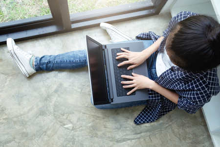 Young woman using computer.の写真素材