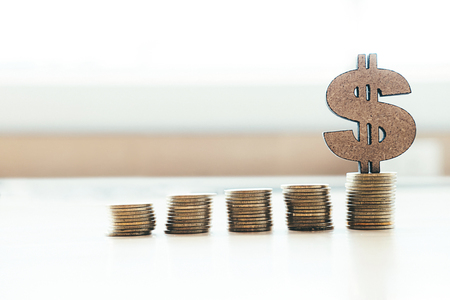 Banking and saving money copyspace background idea concept. Coin stacks and dollar sign. 