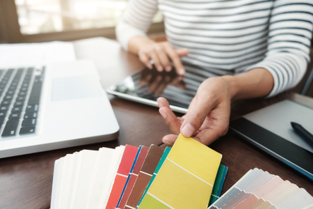 Graphic design and color swatches and pens on a desk. Architectural drawing with work tools and accessories.の写真素材