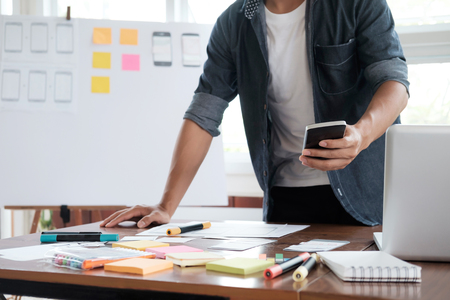 Web designer, UX UI designer planning application for mobile phone.の写真素材