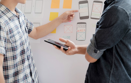 Web designer, UX UI designer planning application for mobile phone.の写真素材