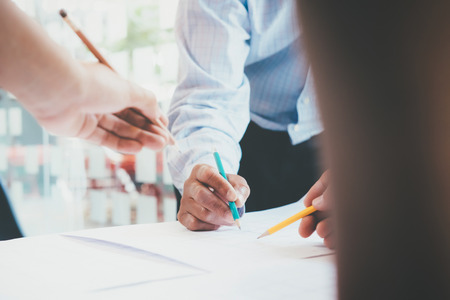 Image of engineer meeting for architectural project working with partner and engineering tools on workplace.の写真素材