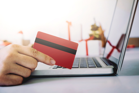 Woman holding credit card and shopping online. New year, Christmas gift shopping.の写真素材