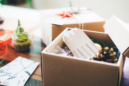 Preparation the Christmas vintage gift box on table. Chrsitmas , Happy New Year and Birthday...