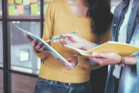 Young startups business people teamwork brainstorming meeting. Business teamwork and education concept.の写真素材