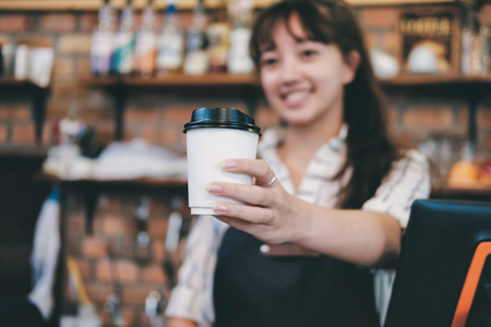 Small Business and Owner Business Concept. Young owner of coffee cafe service customer.の写真素材