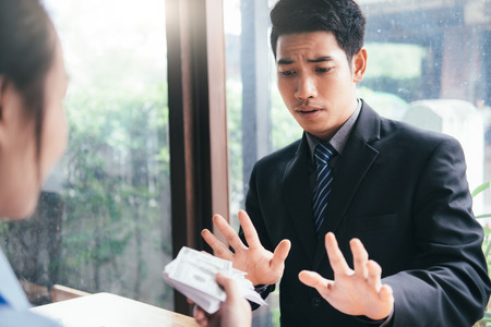 Anti bribery and Anti Corruption concepts. Businessman refusing bribe.の写真素材