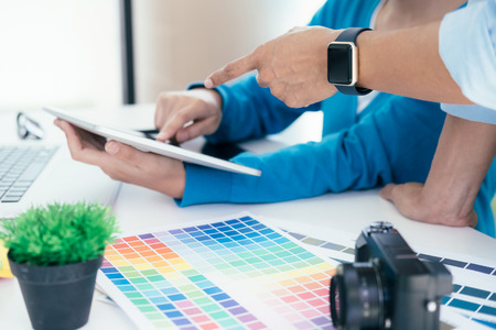 Graphic designer and Photographer working on computer and used graphics tablet.の写真素材