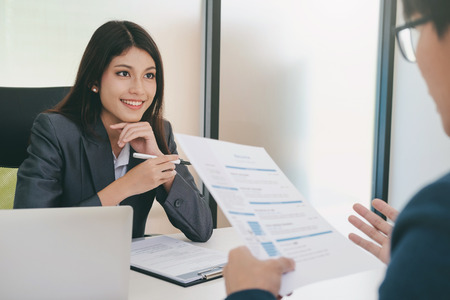Business situation, job interview concept. Confident businessman in a job interview with a corporate personnel manager. の写真素材