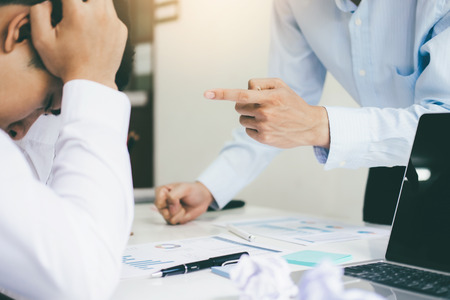 Business teamwork blaming partner and serious discussion. Colleagues argue about investment document  disagree having conflict at work. Bussiness people are serious meeting.の写真素材