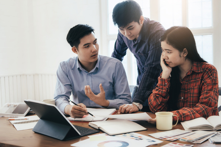 Team of Designer working at office. Brainstorming meeting creative team.の写真素材