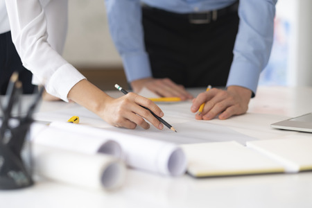 Image of engineer meeting for architectural project working with partner and engineering tools on...