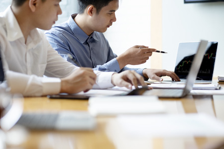 Young startups businessmen teamwork brainstorming meeting to discuss the investment.の写真素材