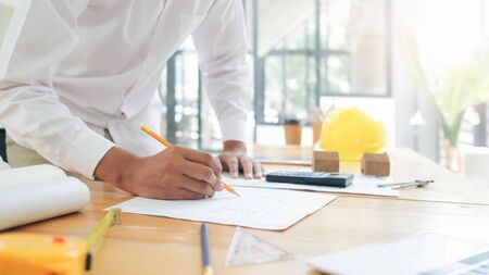 Architect or engineer working in office, Construction concept. Engineering tools.
