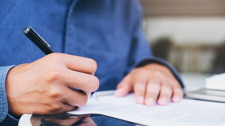 Close up businessman signing contract making a deal. Business concept.