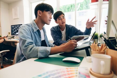 Programmer and UX UI designer working in a software development and coding technologies. Mobile and website design and programing development technology.の写真素材