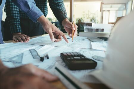 Image of engineer meeting for architectural project working with partner and engineering tools on...