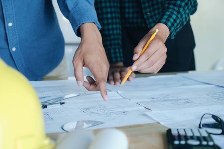 Image of engineer meeting for architectural project working with partner and engineering tools on...