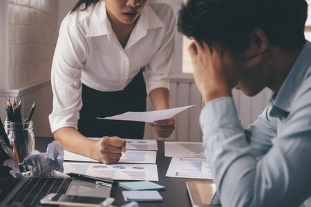 Business teamwork blaming partner and serious discussion. Colleagues argue about investment document  disagree having conflict at work. Bussiness people are serious meeting. の写真素材